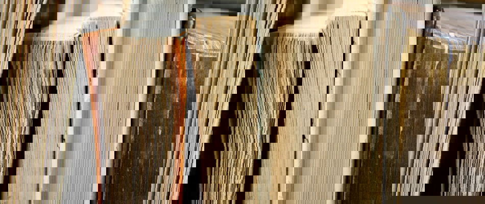 macro photo of five assorted books